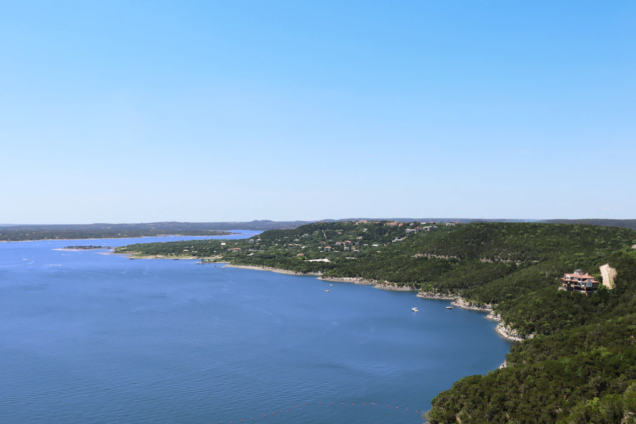 Lake Travis shoreline and surrounding hills.